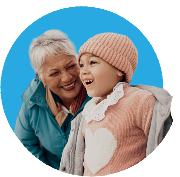 Grandparent laughing joyfully with a young child